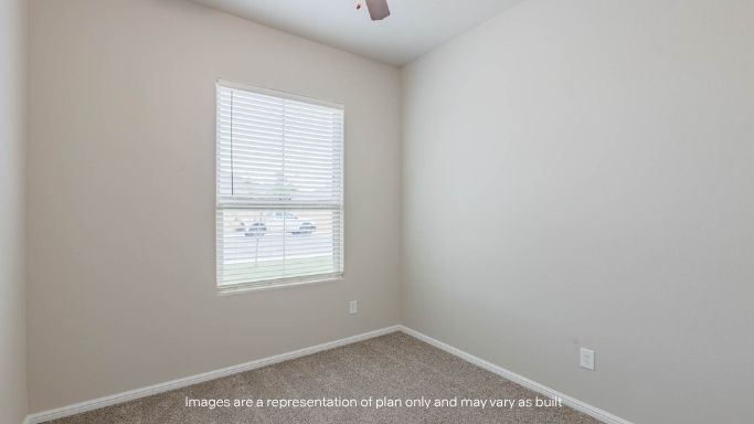 Guest bedroom 1 with front windows and ample natural light