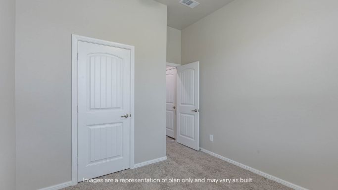 Guest bedroom 1 with front windows and ample natural light