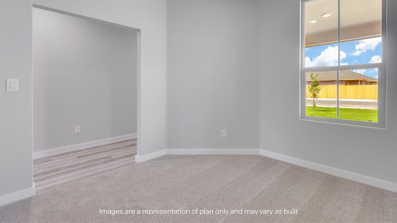 A flexible front room perfect for a home office, playroom, or sitting area.