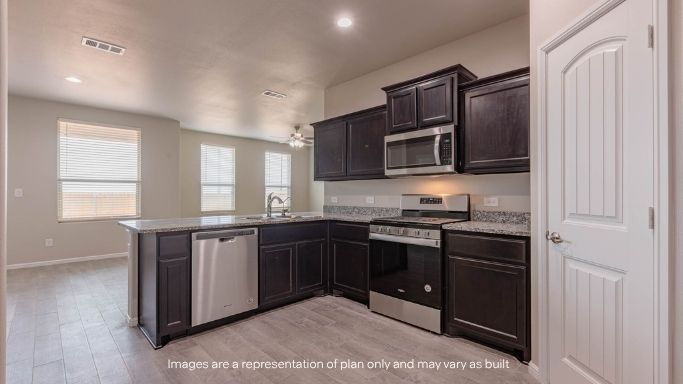 Spacious open concept kitchen with island and counter prep space