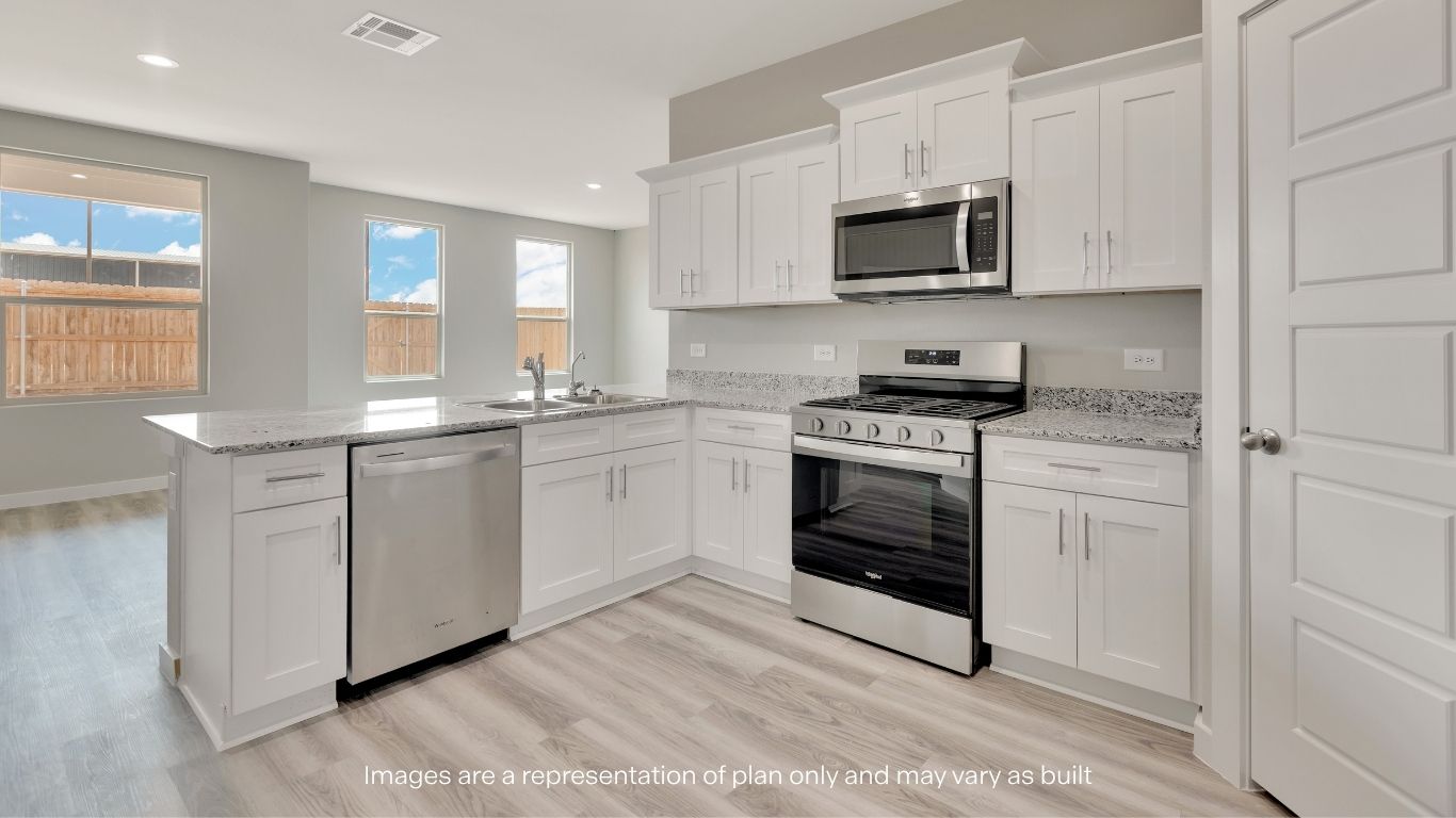 The open-concept kitchen is the heart of the home.
