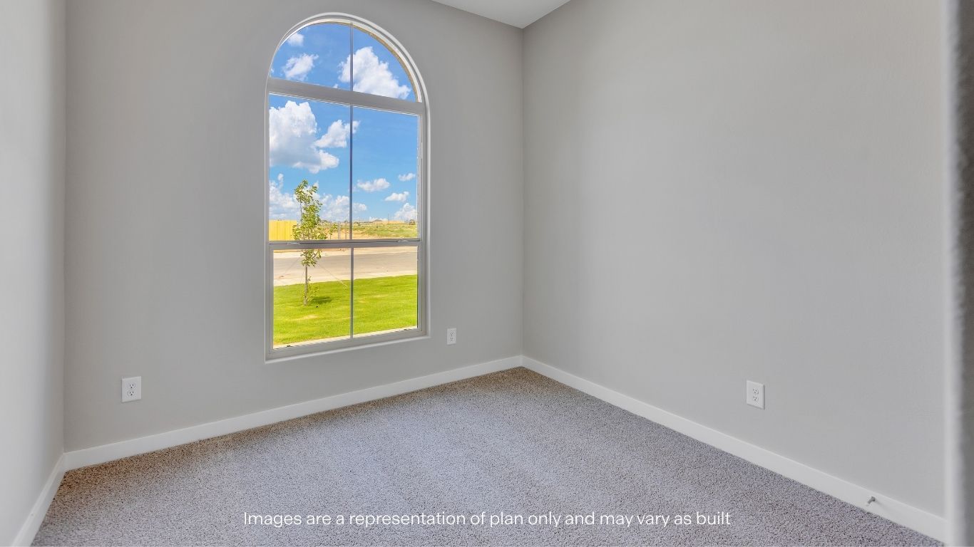 Natural light pours through the stunning front arched window.