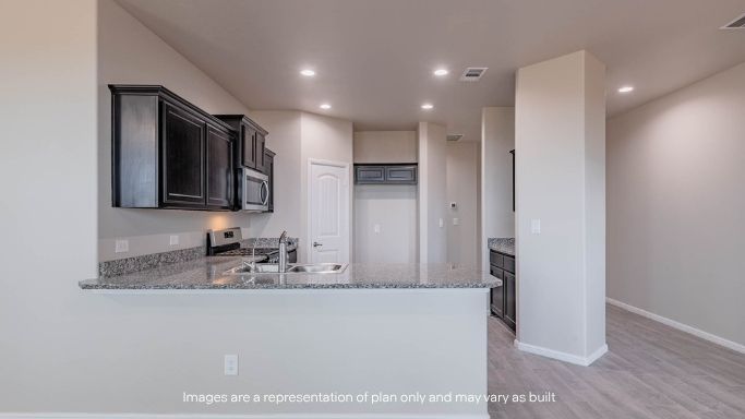 Spacious open concept kitchen with island and counter prep space
