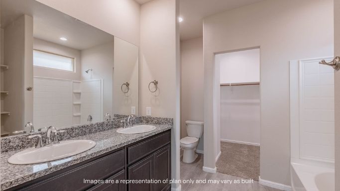 Primary bathroom with luxurious shower and built in storage