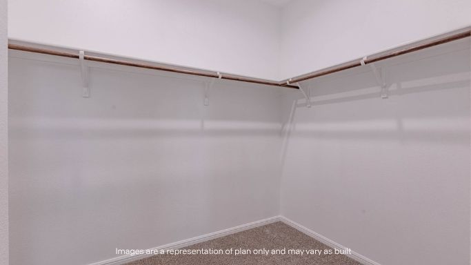 Primary walk-in closet with extra storage space