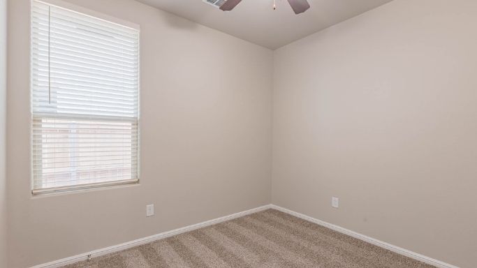 Guest bedroom 3 with plush carpet floors and spacious closet