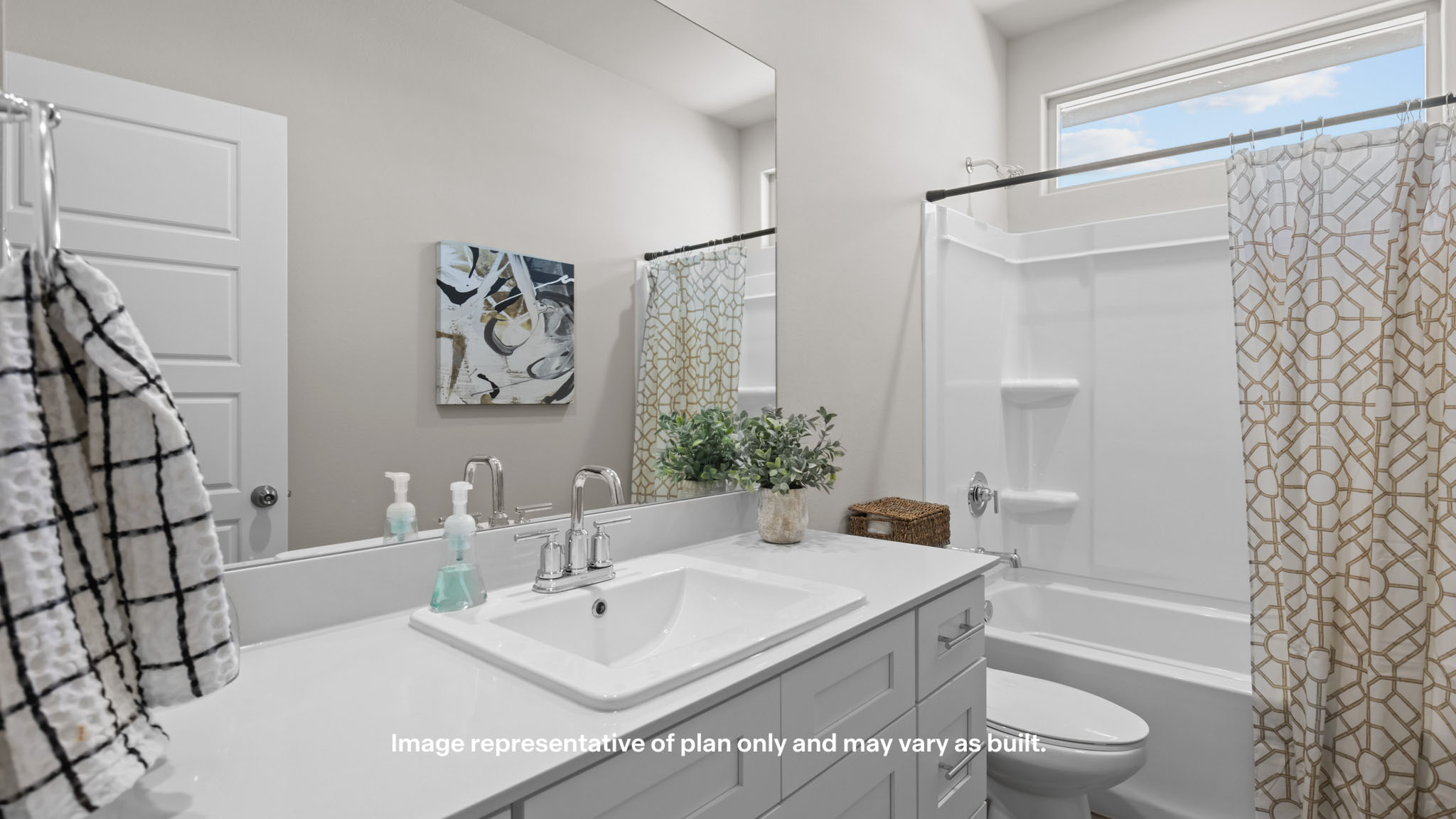 Guest bathroom with built in vanity and combination bathtub shower