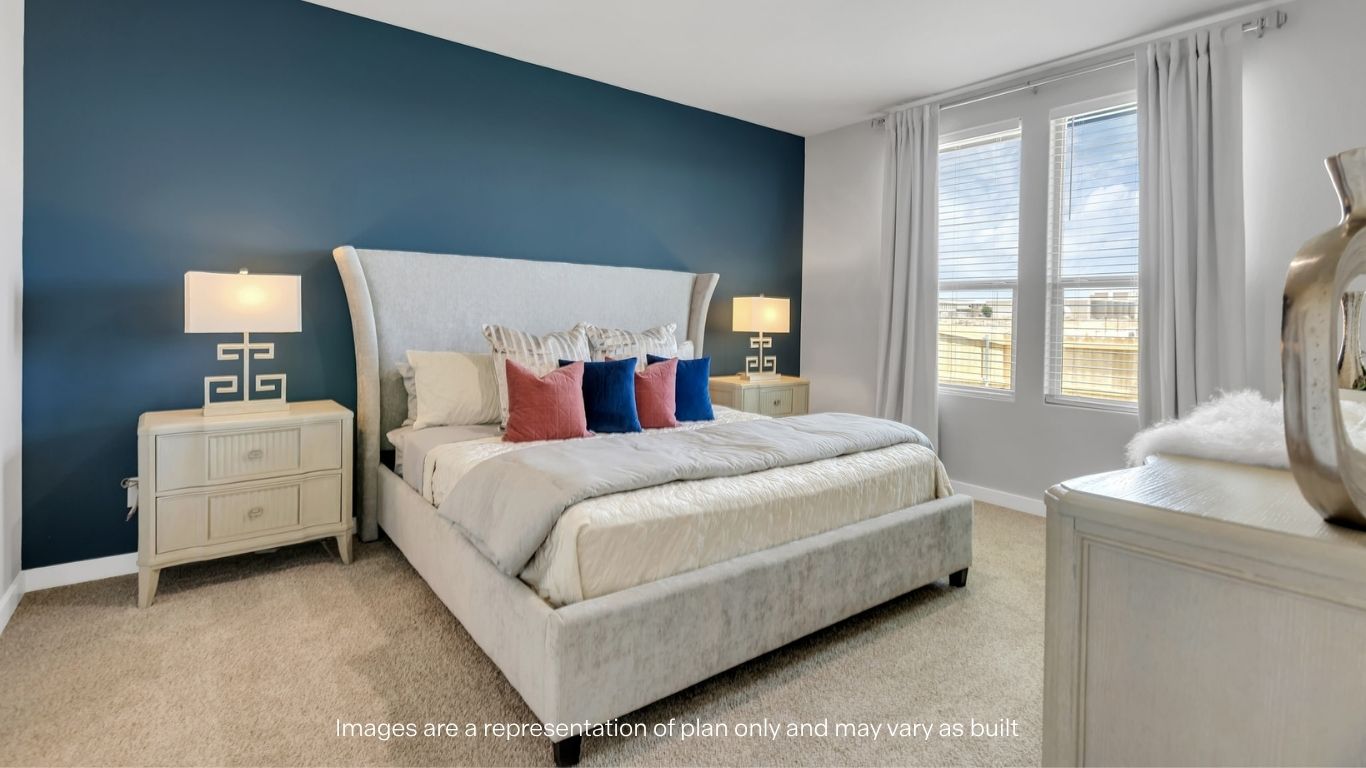 Primary bedroom with plush carpet floors and light allowing double windows
