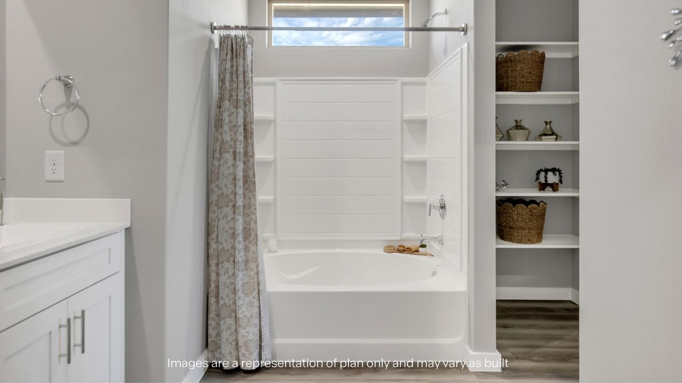 Primary bathroom with luxurious shower and built in storage