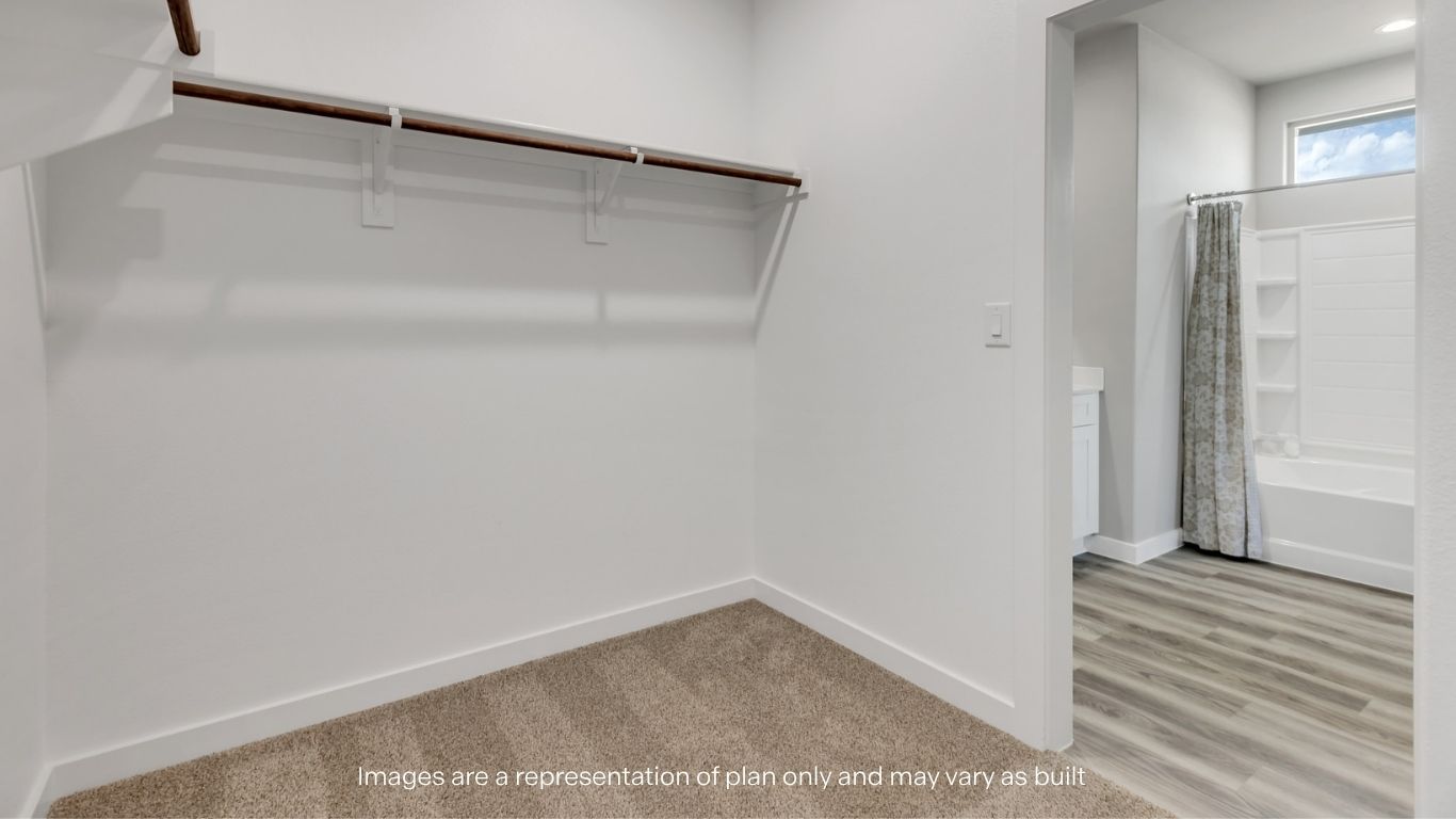 Primary walk-in closet with extra storage space