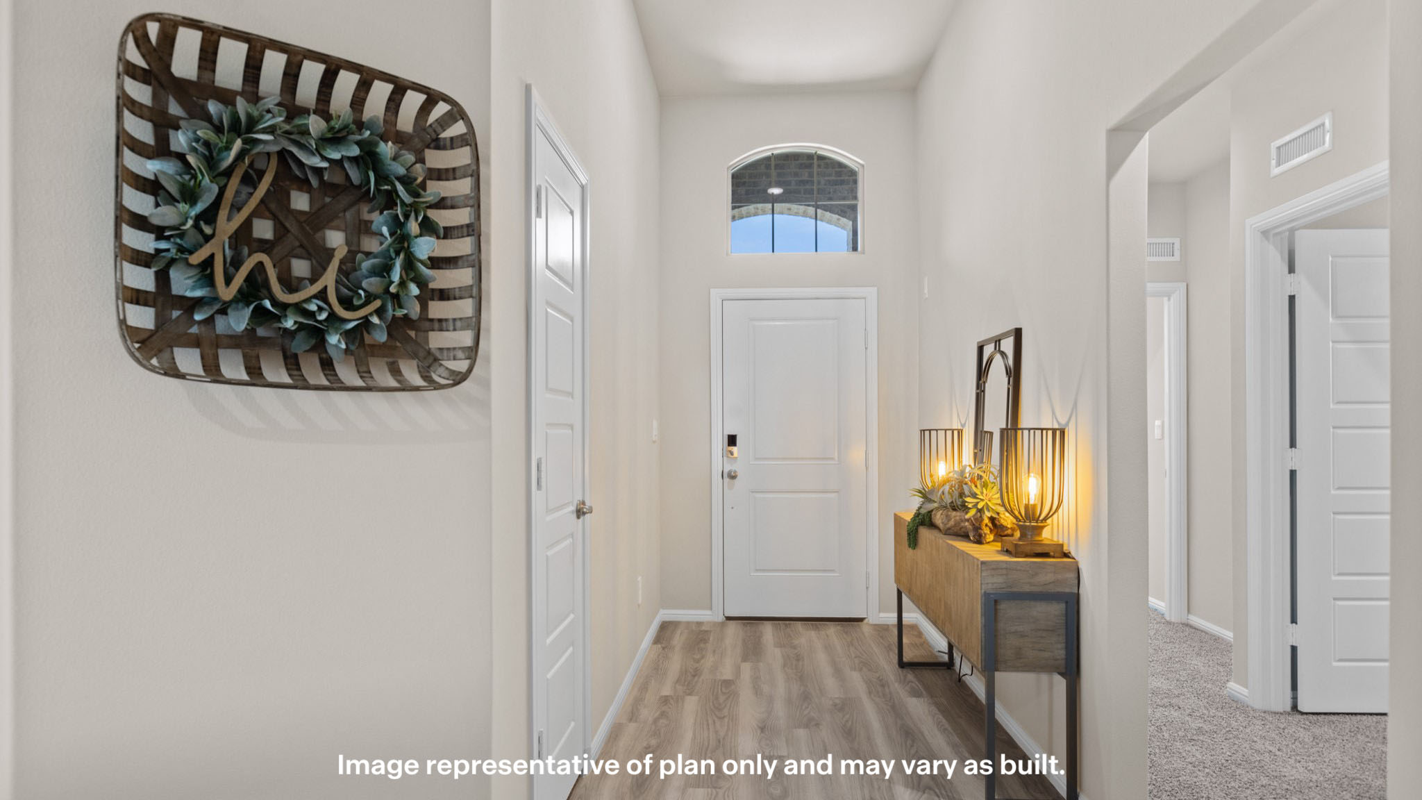Spacious open entry space with guest bedrooms to the side