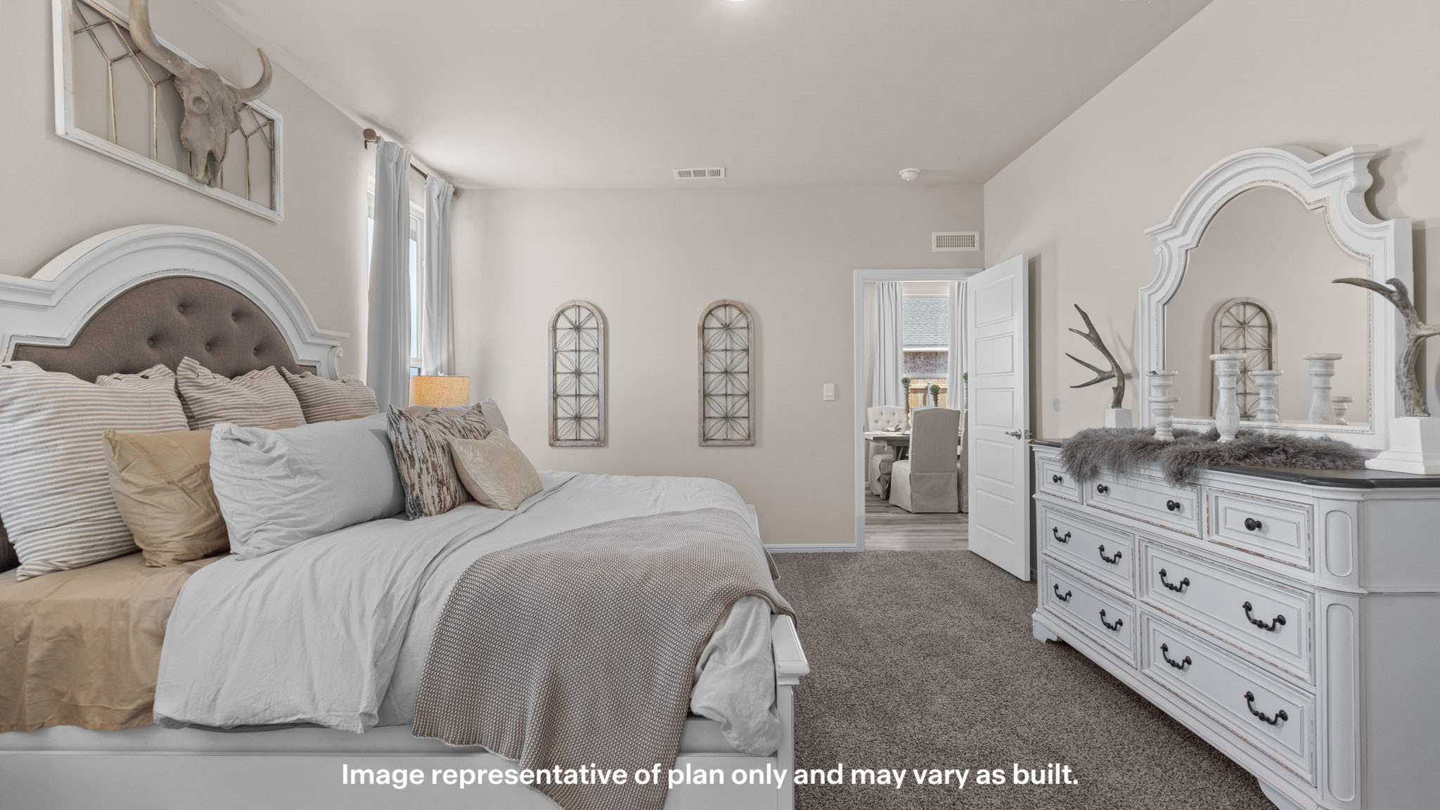 Primary bedroom with plush carpet floors and light allowing double windows