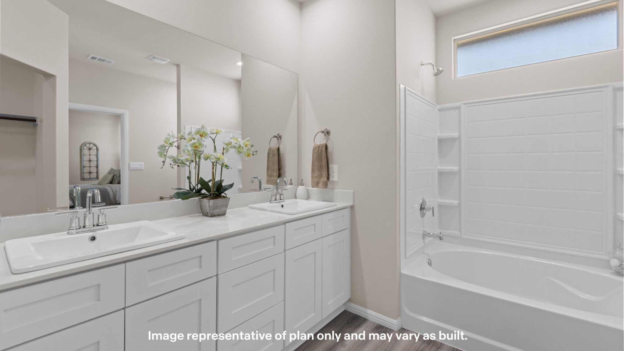 Primary bathroom with built in vanity and luxurious shower