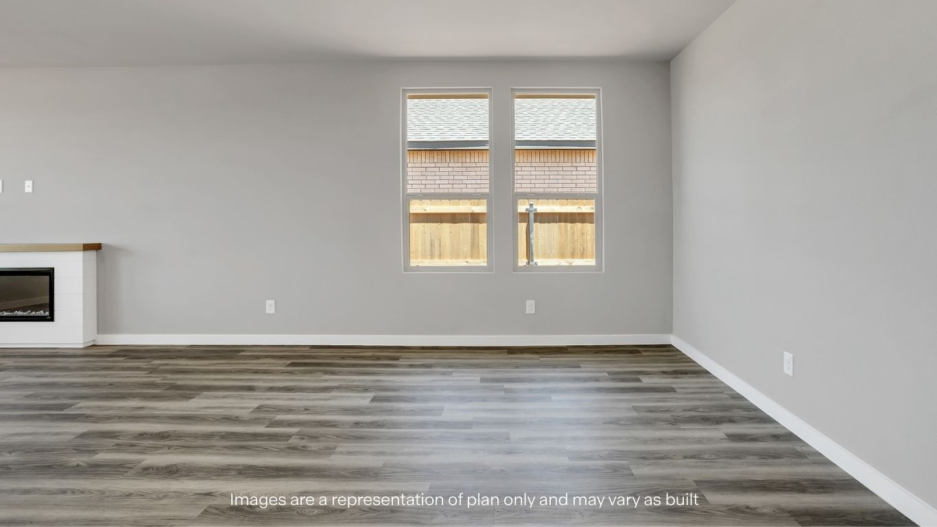 A different angle of the living room highlighting the open layout and modern finishes.