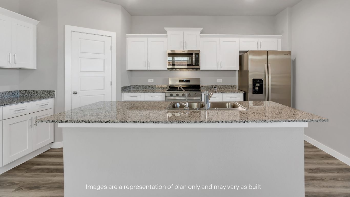 A centered view of the kitchen island with double sinks and ample counter space.