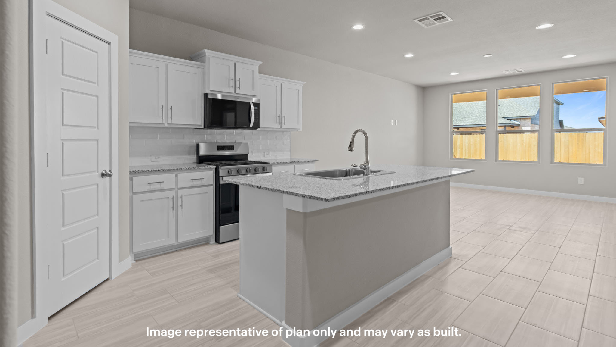 Spacious open concept kitchen with island and counter prep space