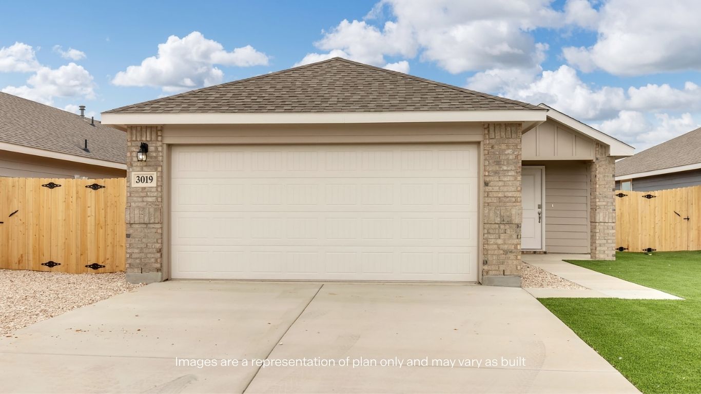 Charming single-story home featuring attractive brick accents, a spacious two-car garage, and a clean, low-maintenance exterior.