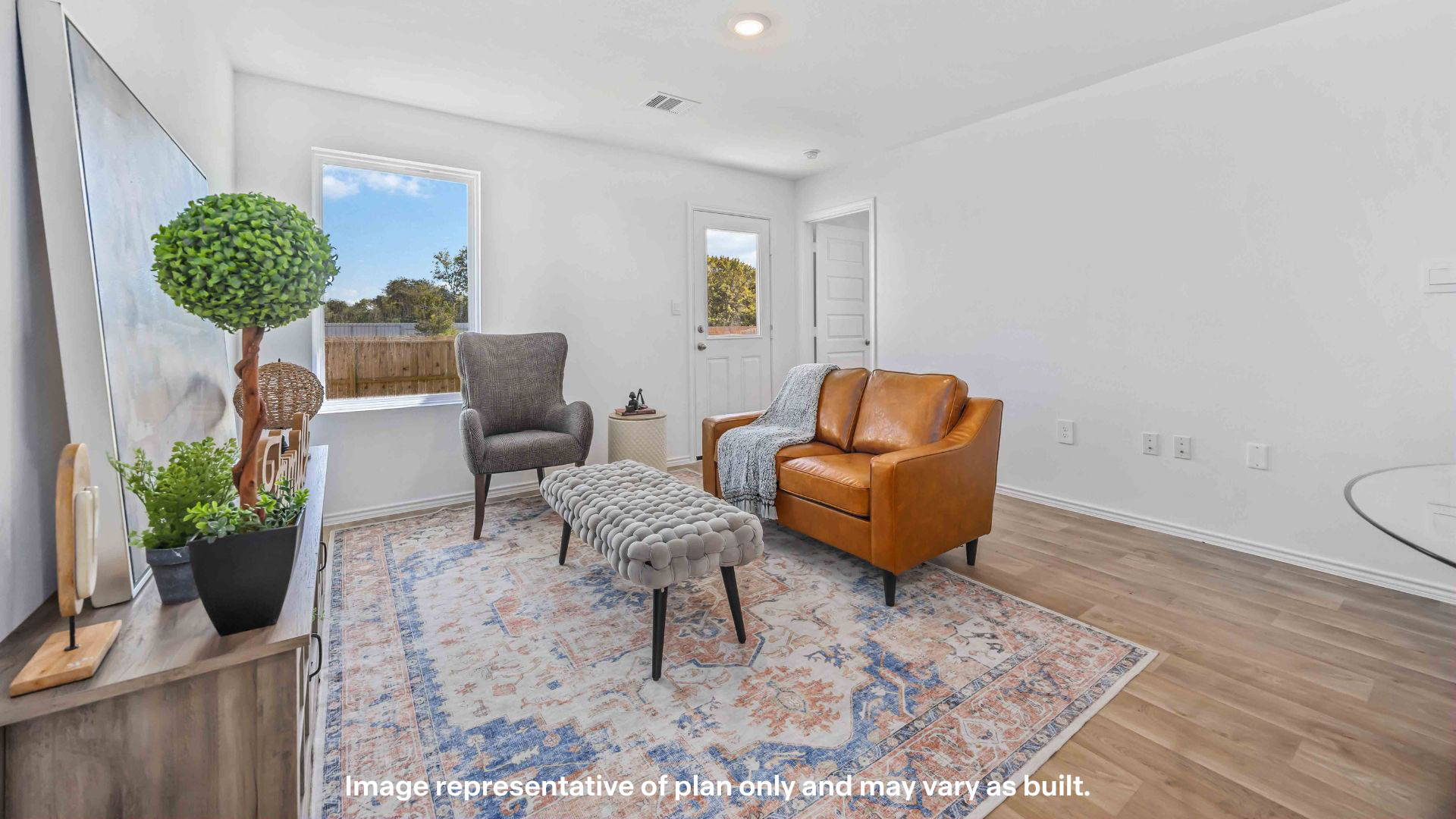 Spacious living and family room space with light allowing windows