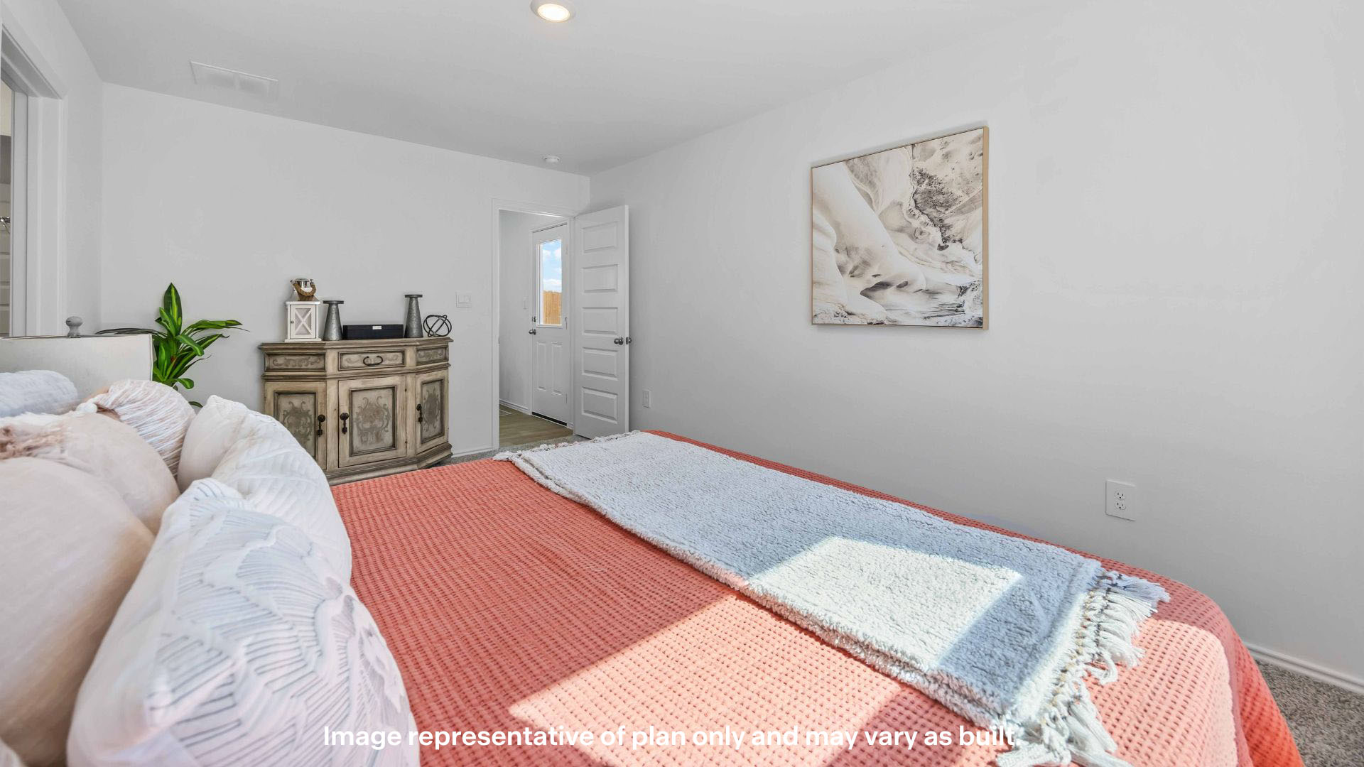 Primary bedroom with private attached bathroom and walk-in closet