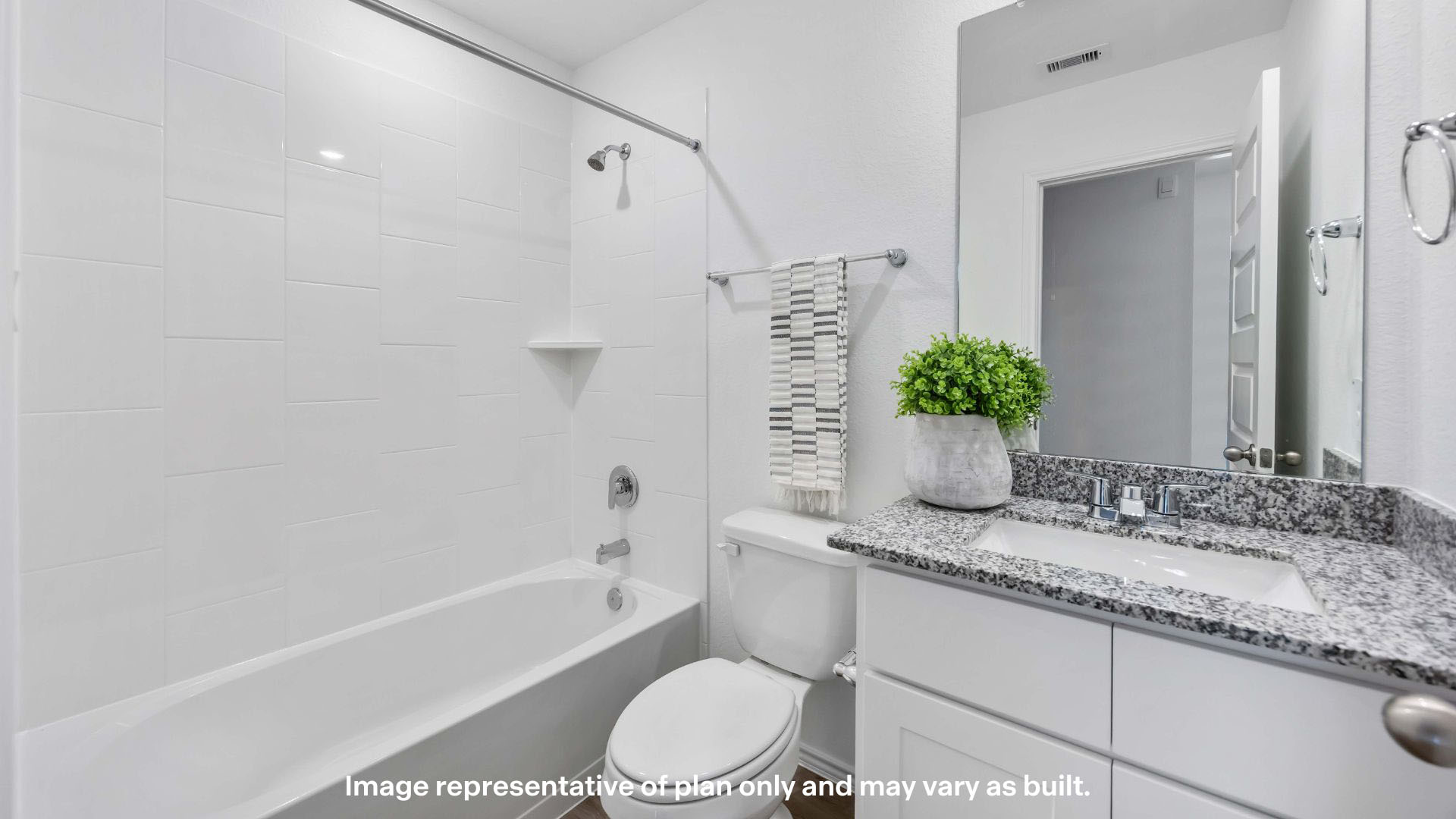 Guest bathroom with built in vanity and combination bathtub shower