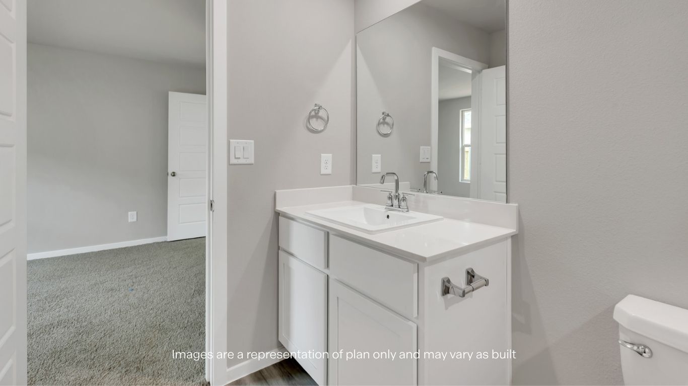 Bright bedroom offering flexibility for guests or a home office.