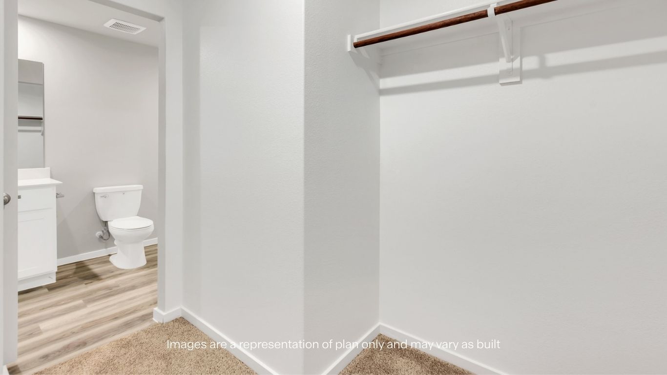 Private bath featuring an easy-maintenance walk-in shower.