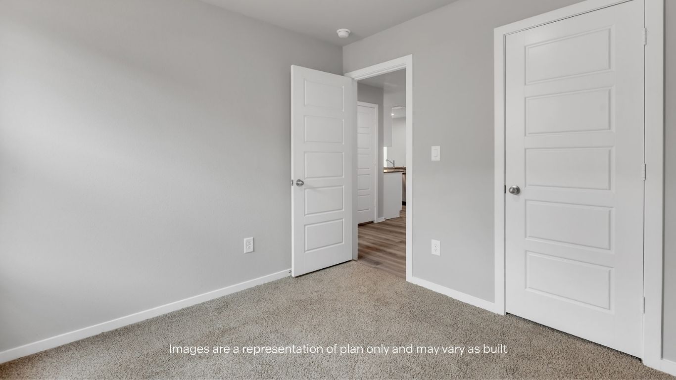 Large walk-in closet designed for organization.