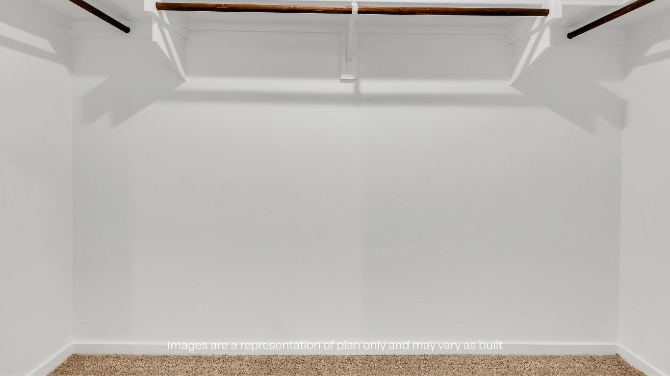 A generous walk-in closet provides plenty of storage space to keep everything organized.
