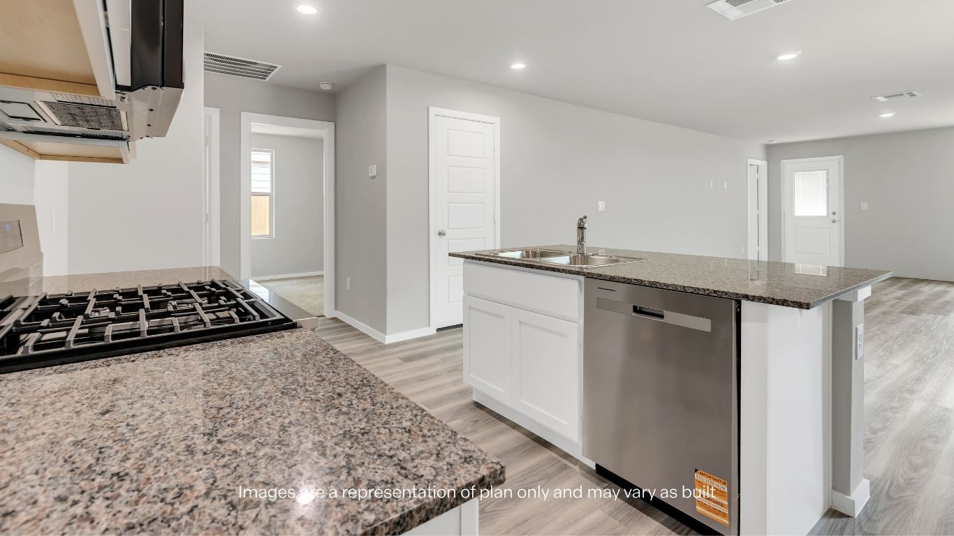 A spacious island with additional seating creates the perfect gathering place for family and friends.