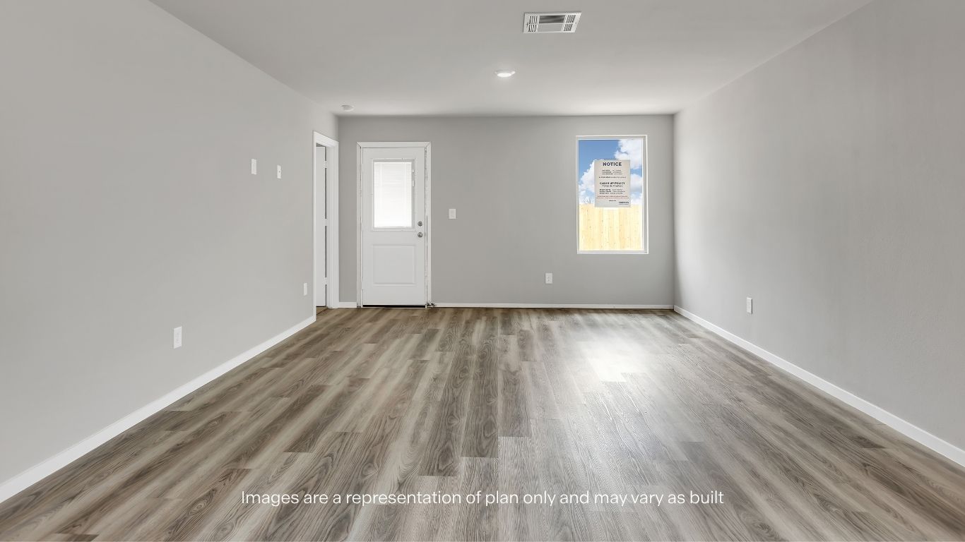 The bright and open living area provides plenty of room to relax, entertain, and make lasting memories.