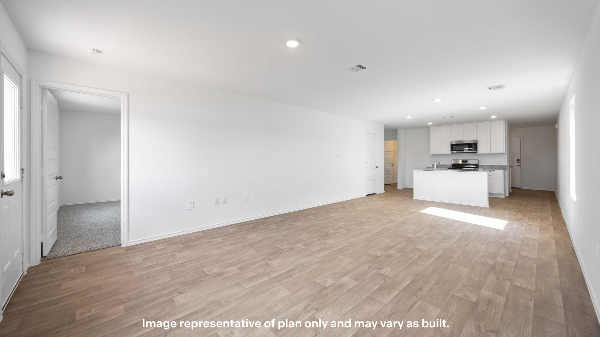 Spacious living and family room space with light allowing windows