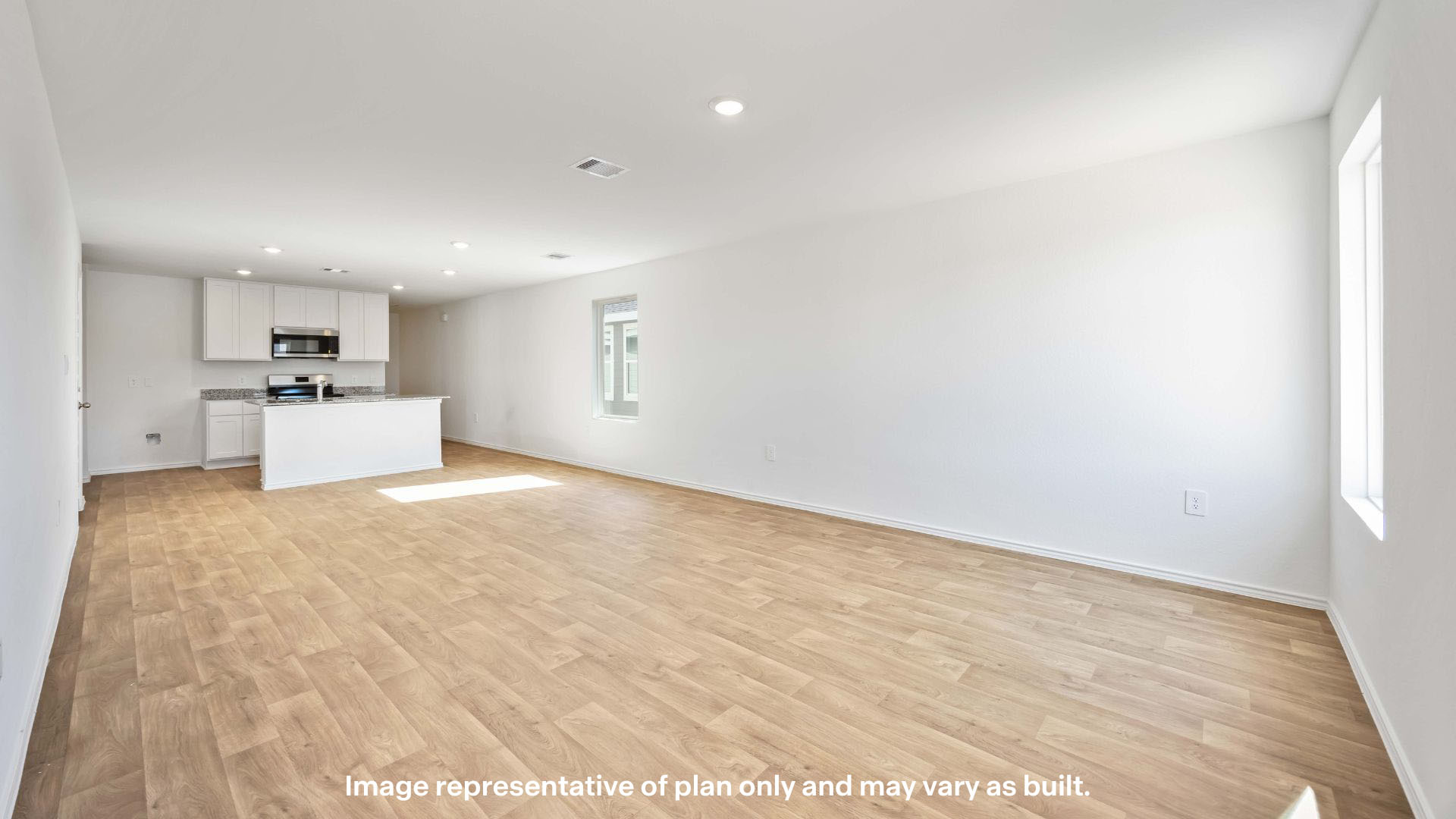 Open concept kitchen, living, family, and dining room space
