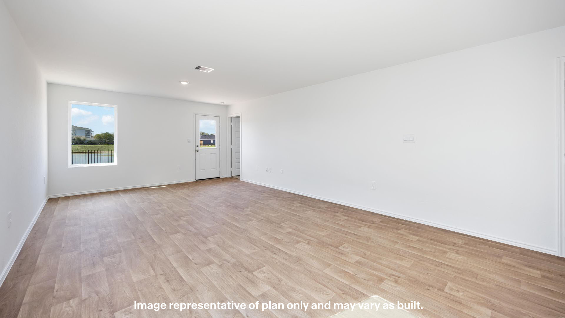 Spacious living and family room space with light allowing windows