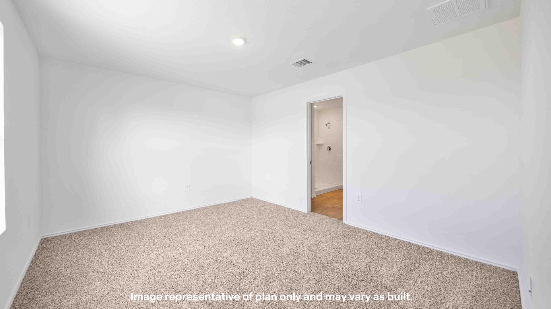 Primary bedroom with private attached bathroom and walk-in closet