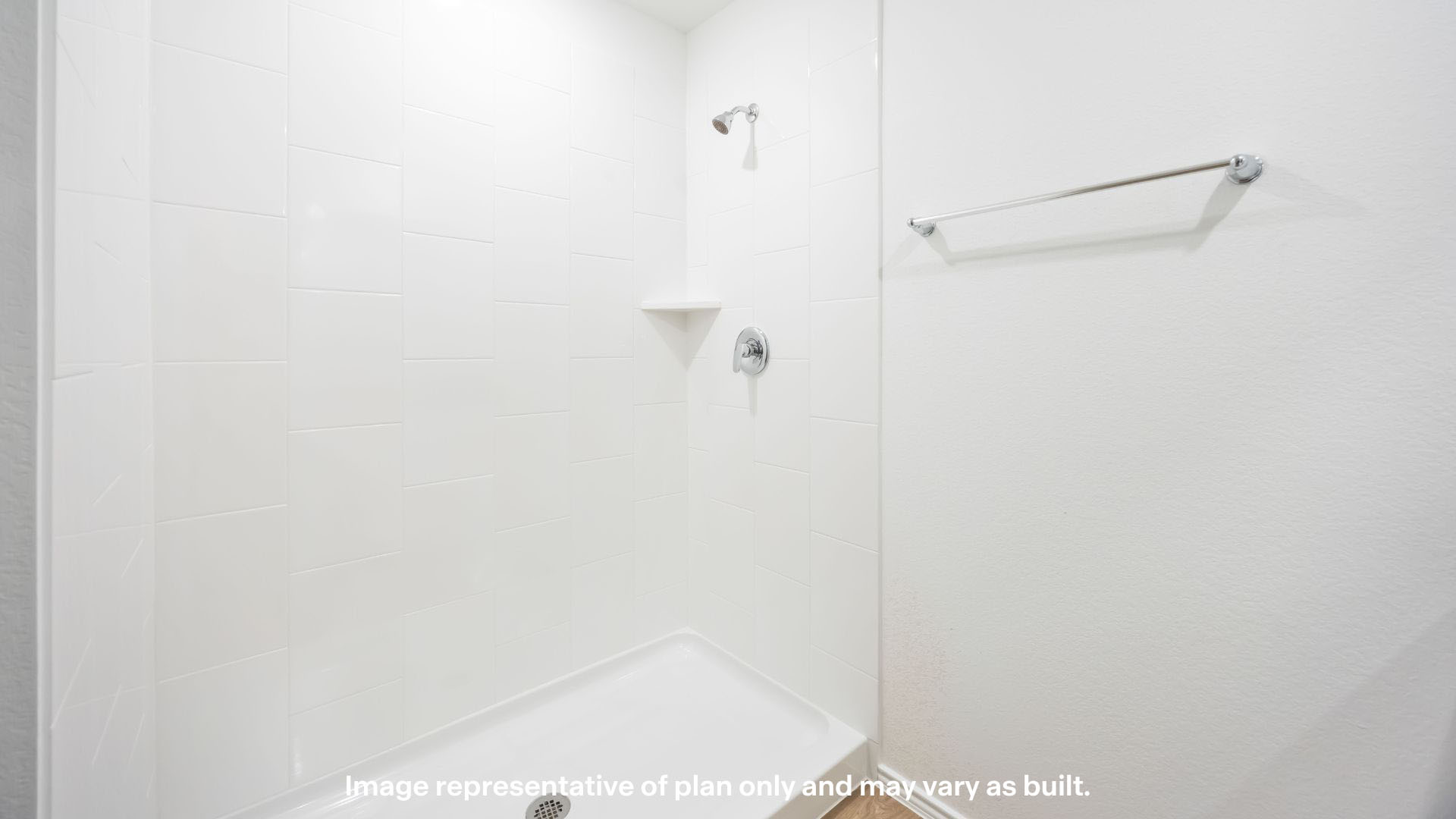 Primary bathroom with built in vanity and luxurious shower