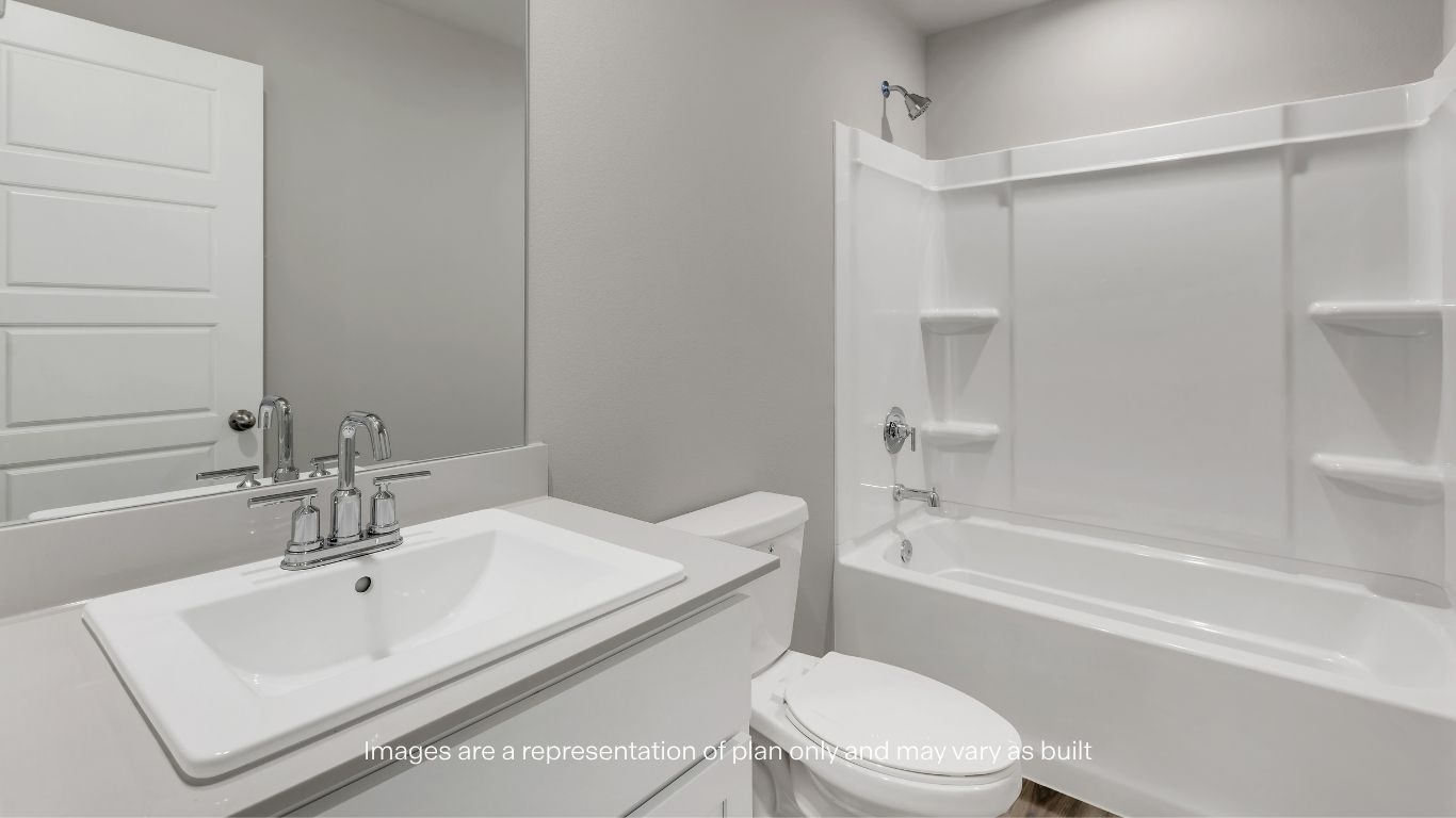 Comfortable and inviting, this bedroom features plush carpeting and a convenient closet.