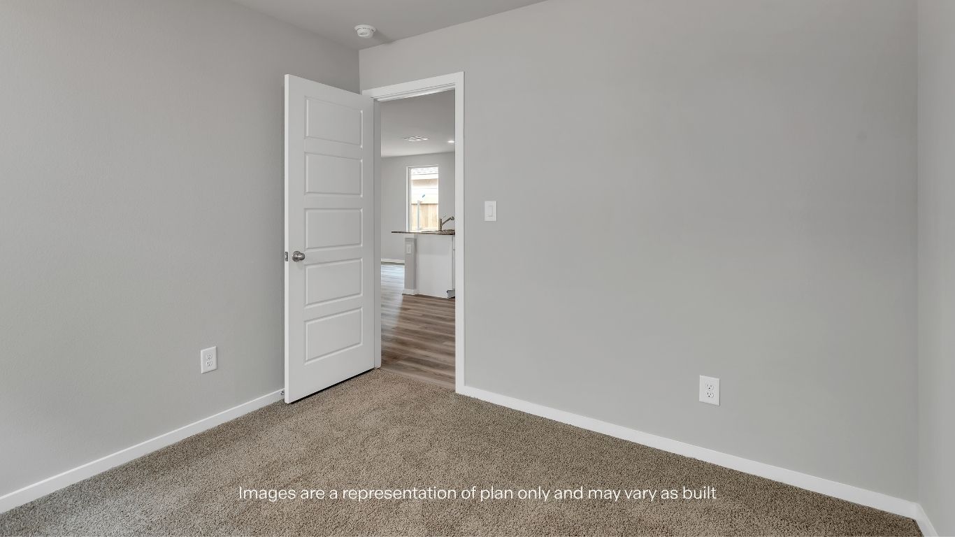 This well-sized bedroom offers flexibility for growing families, hobbies, or work-from-home needs.