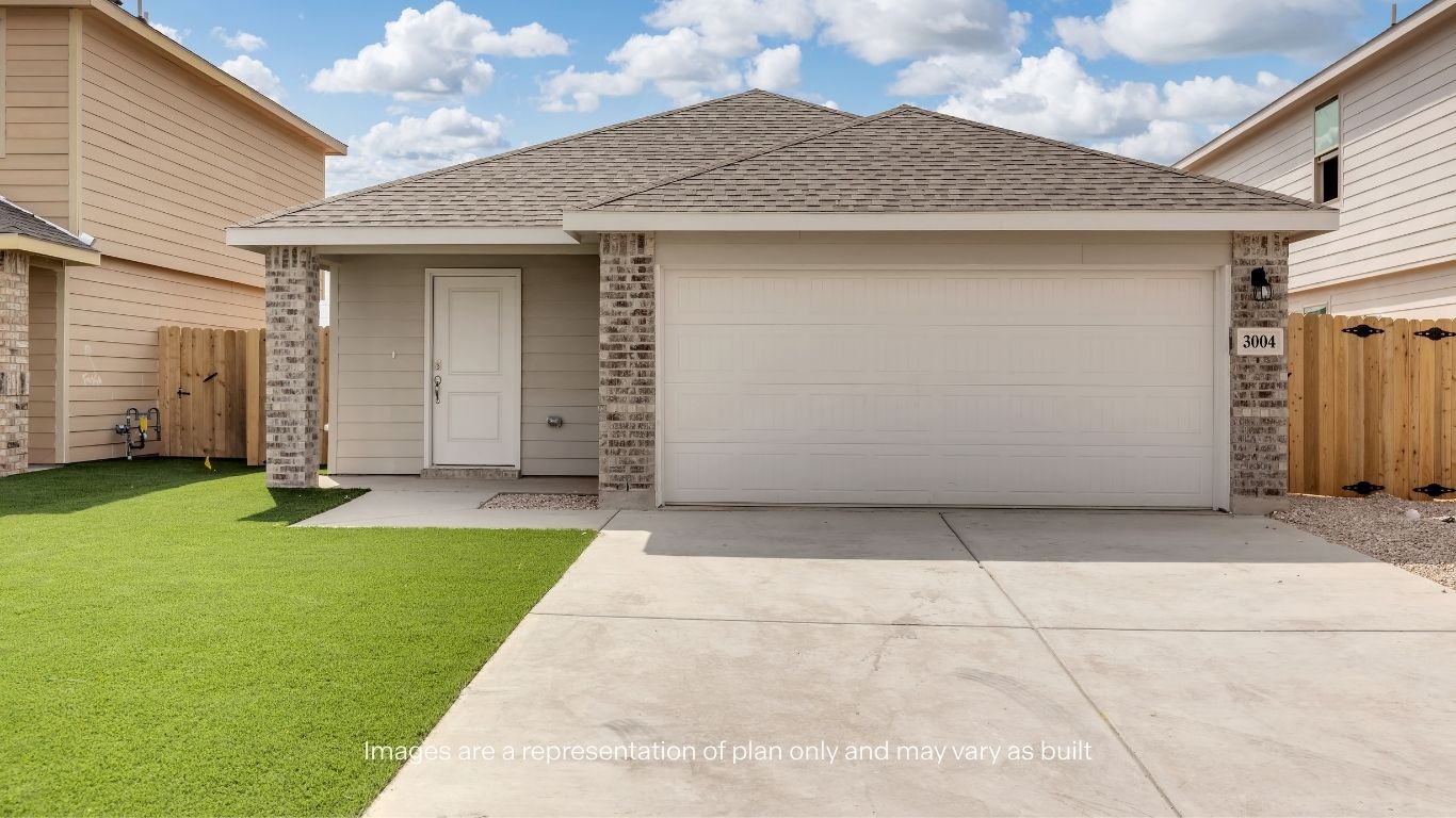 Inviting exterior with a two-car garage and fresh, low-maintenance landscaping.