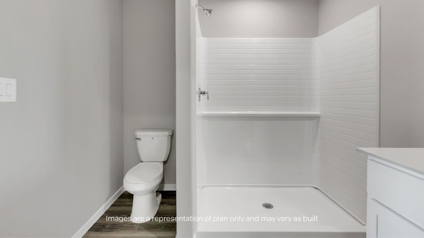 Walk-in shower with sleek, low-maintenance finishes.