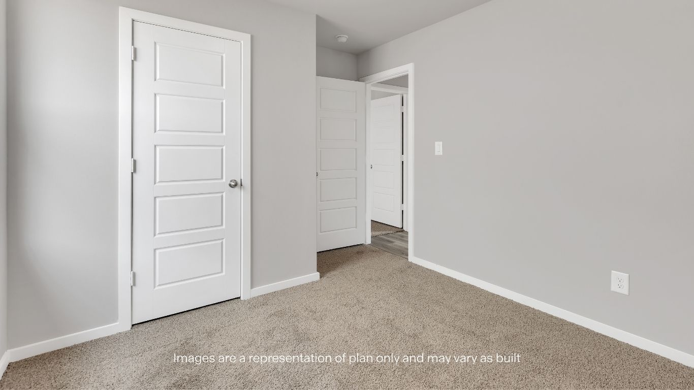 Functional guest room or office space with neutral finishes.