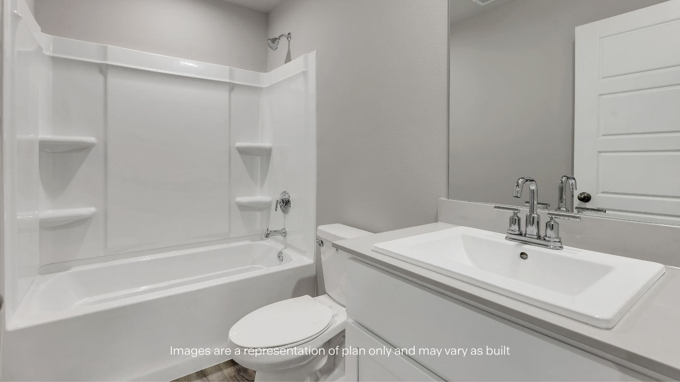 Well-appointed secondary bath with a tub/shower combo and modern vanity.