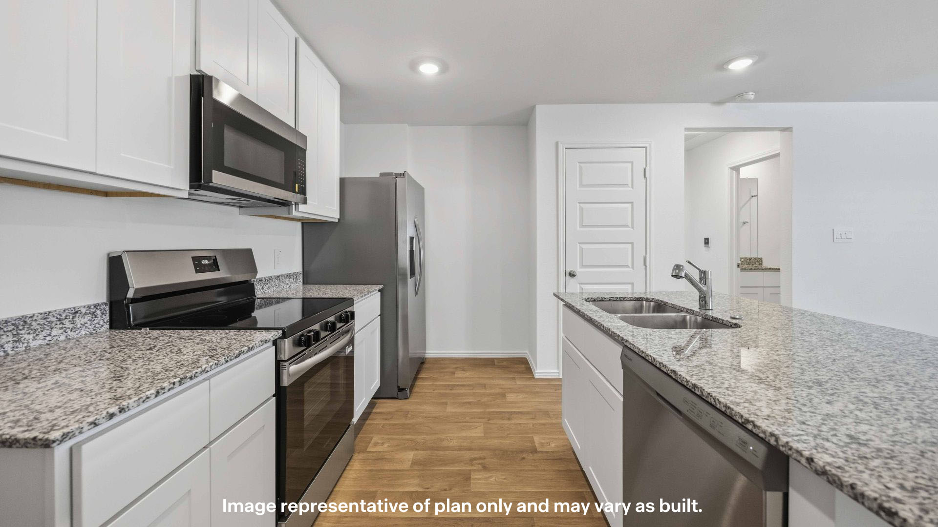 Open concept kitchen with stainless steel appliances, shaker style cabinets, and elevated finishes