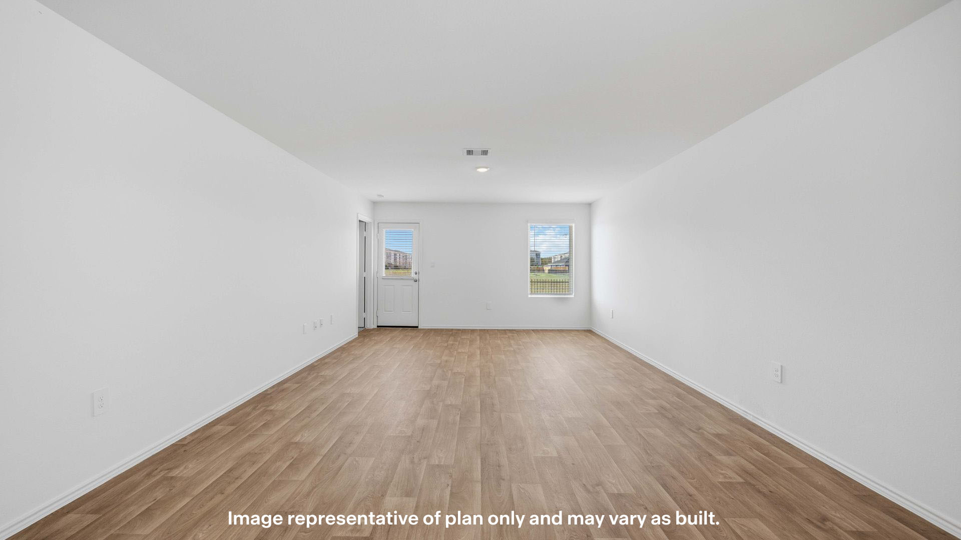 Spacious living and family room space with light allowing windows