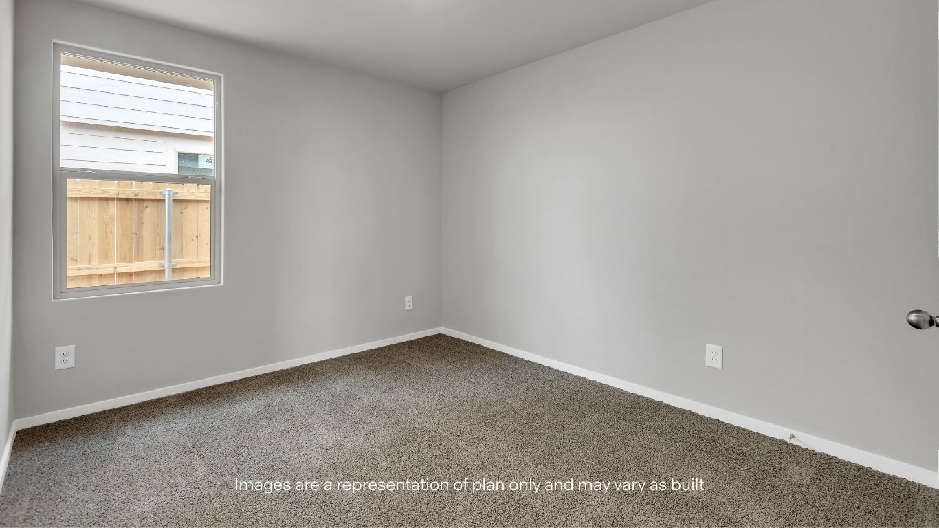 Versatile secondary bedroom perfect for guests or a home office.