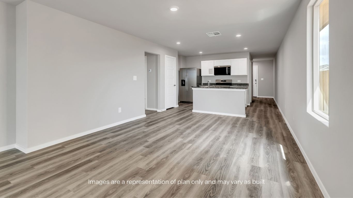 Spacious living room filled with natural light and ideal for gathering.
