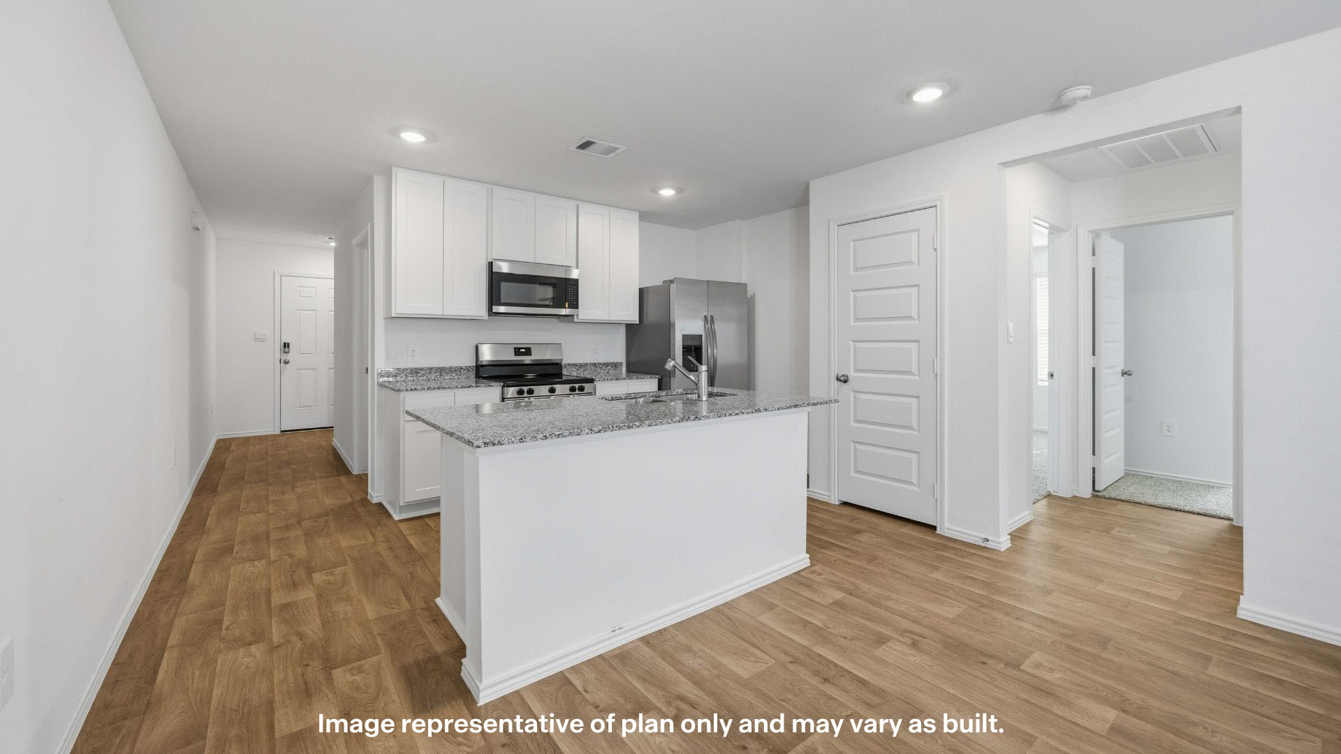Spacious open concept kitchen with island and counter prep space