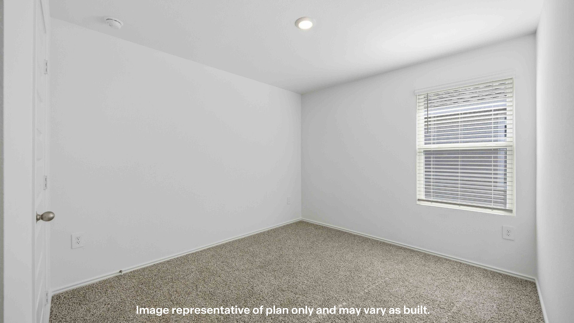 Guest bedroom 2 with side window and plush carpet floor