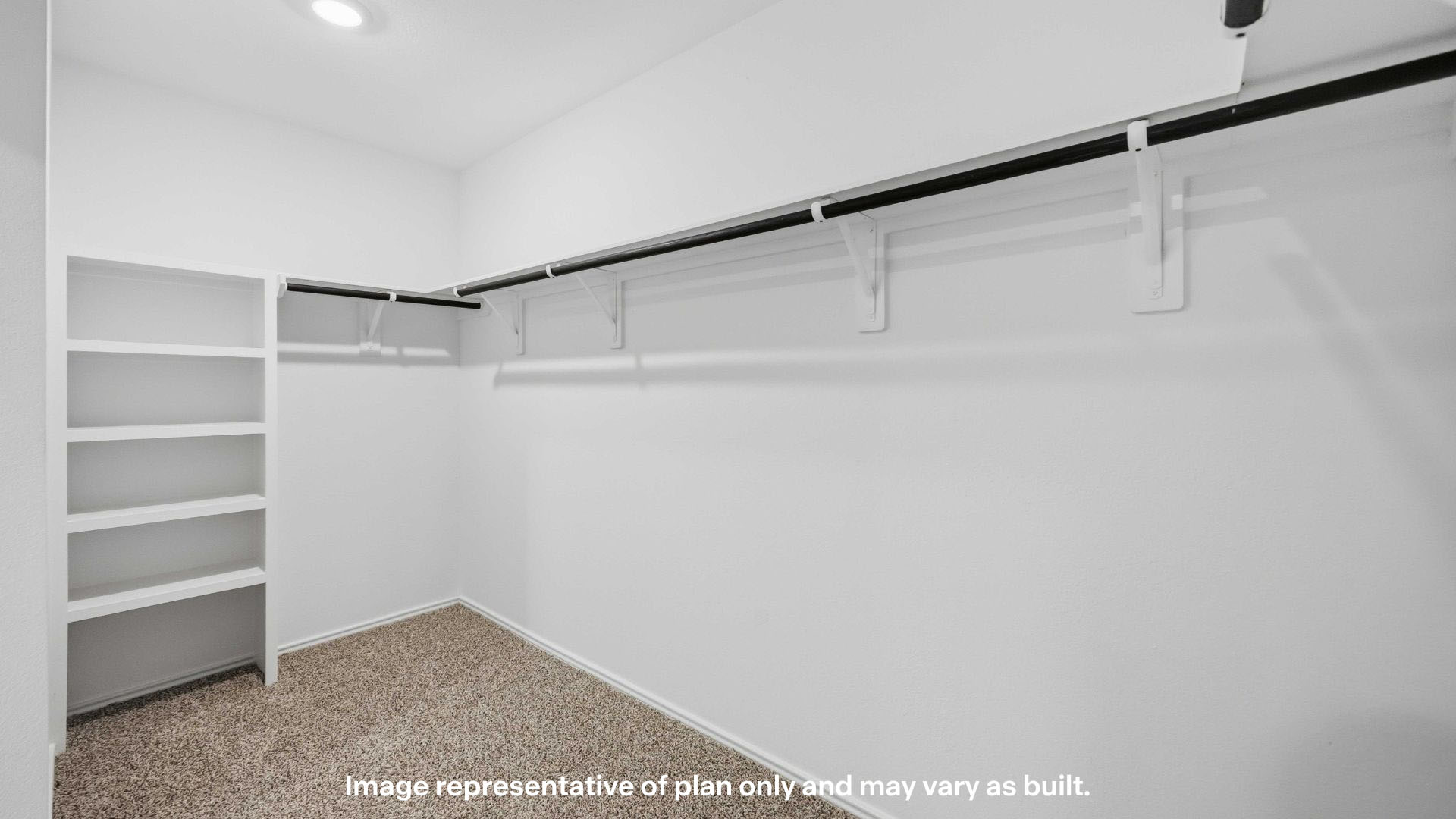 Private primary walk-in closet with extra storage space