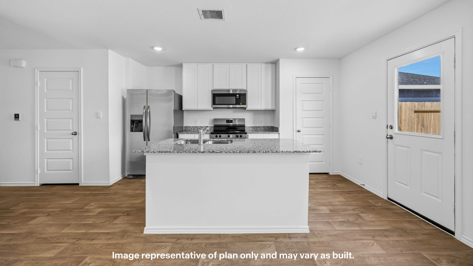 Spacious open concept kitchen with island and counter prep space