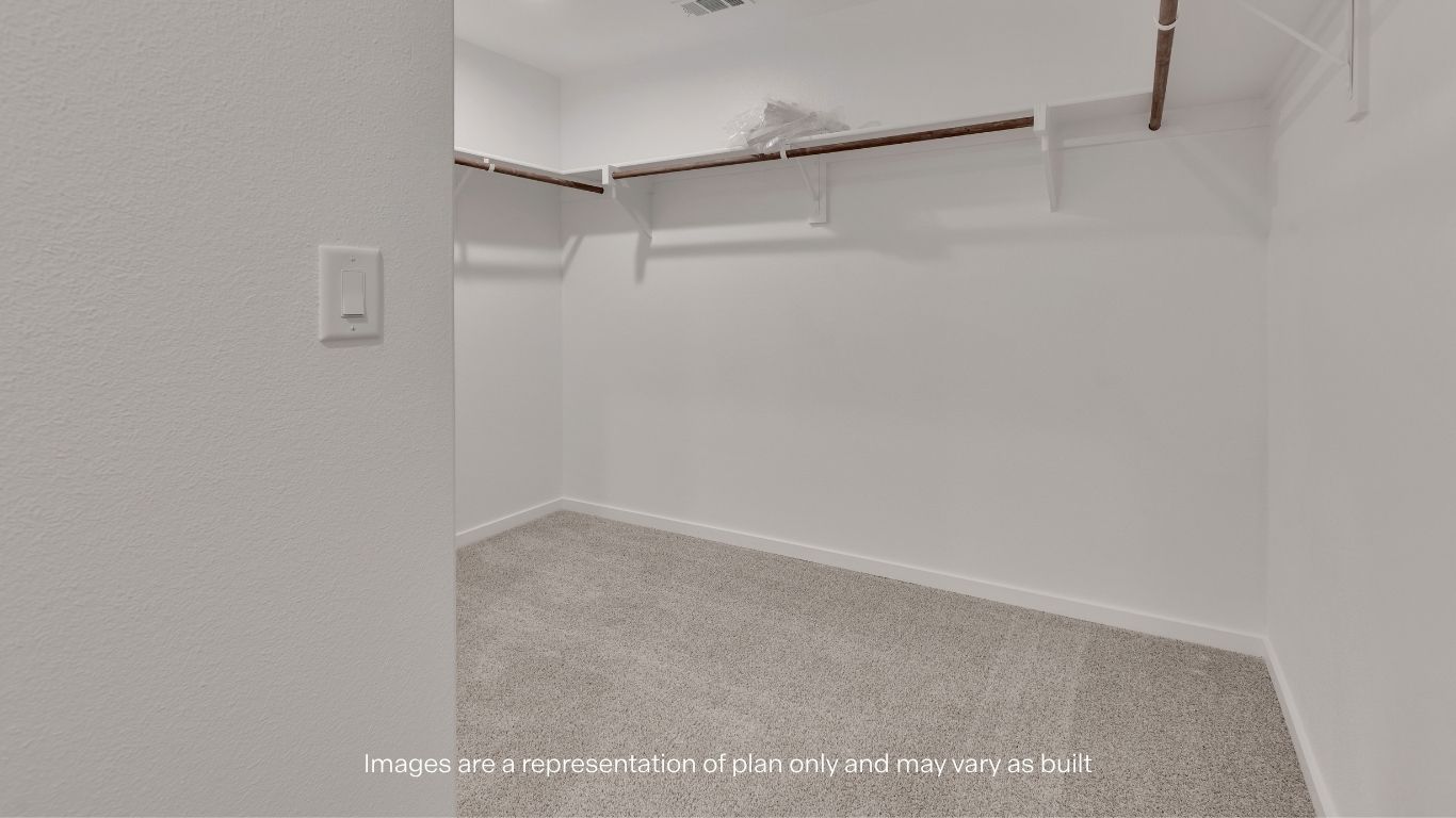 The impressive walk-in closet offers abundant storage space to help keep your wardrobe organized.